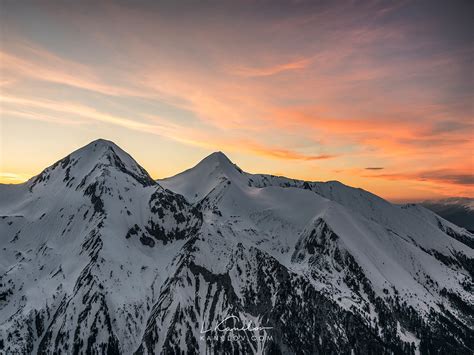 Sunset Over Snowy Mountain Peaks Landscapes Nature Print By Luke Kanelov