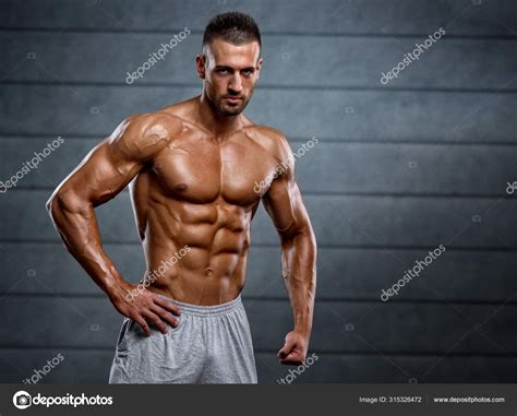 Strong Muscular Men Flexing Muscles Stock Photo By Mrbigphoto
