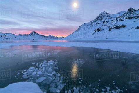 Ice Bubbles Frame The Frozen Lago Bianco At Dawn Bernina Pass Canton