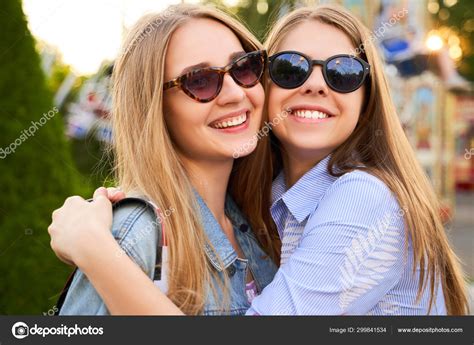 Two Girls Best Friends Happily Hug Each Other Stock Photo By ©sky