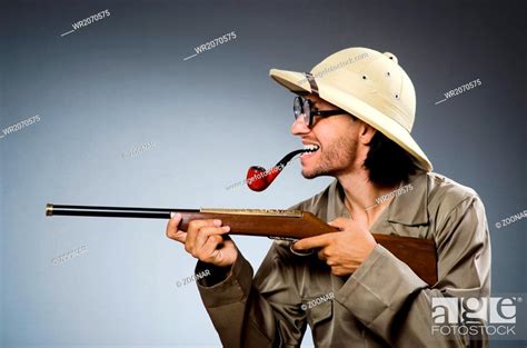 Hunter With Rifle And Smoking Pipe Stock Photo Picture And Royalty