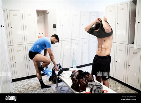 Two Men Changing In The Locker Room At The Gym Stock Photo Alamy