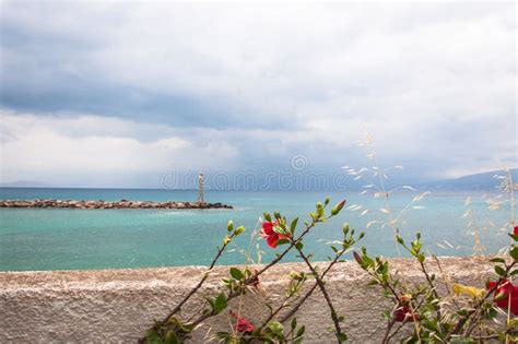 Scenic Aegean Seascape With Flowers And Lighthouse Stock Photo Image
