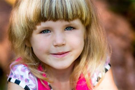 Beautiful Portrait Of A Happy Little Girl Smiling Stock Photo Image