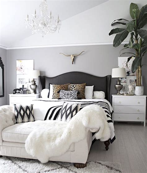Black walls, a black painting, and a black headboard are contrasted by pops of rich green color and white bedding in this black and white bedroom that follows one of nelson's suggestions for decorating a space with these colors. Glamorous Bedroom | Black And White Room Ideas That Will ...
