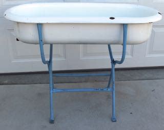 When you have babies and travel it is necessary to have a travel bathtub that is comfortable and safe. Very unusual Antique enamel Baby Bathtub on stand ...