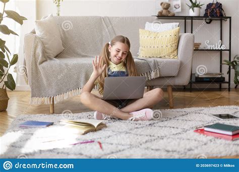 Looking for a good deal on computer wave? Girl Sitting On Floor Using Computer And Waving To Webcam ...