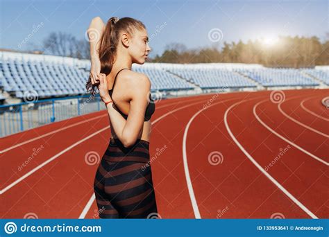 Young Fitness Woman Runner Warm Up Before Running On Track Stock Image