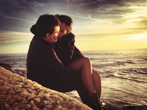 Couple Hug And Kiss At Beach With Sunset Sea Sky And Clouds
