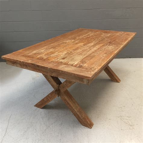 Brown dining table anchors your eating area in classic style. Cross Leg Dining Table - Nadeau Nashville