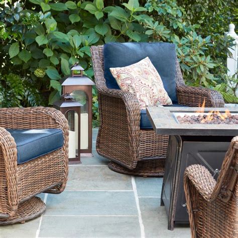 The fire pit has an antique bronze finish with a natural slate tabletop and a black base that holds a propane tank. Hampton Bay Crossridge 50,000 BTU Antique Bronze Finish ...