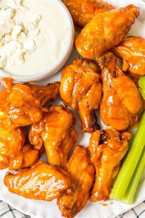 This year, these baked buffalo wings have been added to the menu and i can't make them fast enough. Buffalo Wings Recipe (VIDEO) - Baked Buffalo Chicken Wings