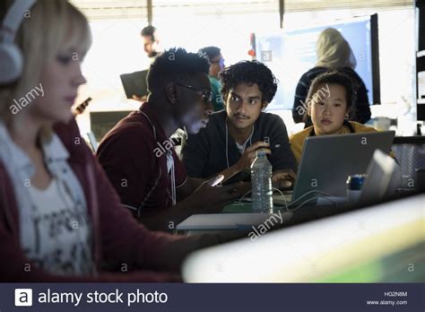 Hacker Team Working Hackathon At Laptop In Dark Office Stock Photo Alamy