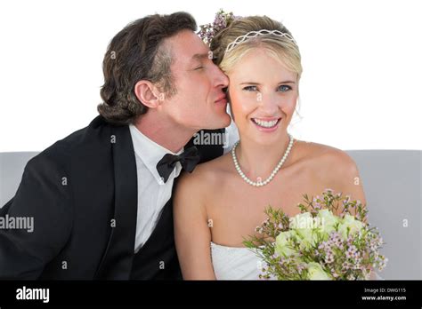 Happy Bride Being Kissed By Groom Stock Photo Alamy