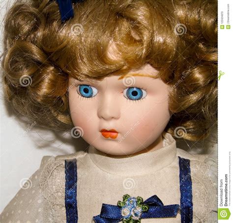 Closeup Of A Blonde Porcelain Doll On White Background Vintage Toys