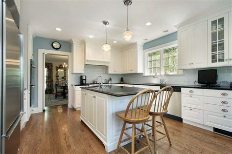 Gray Blue Walls Provide Slight Splash Of Color In This White Kitchen