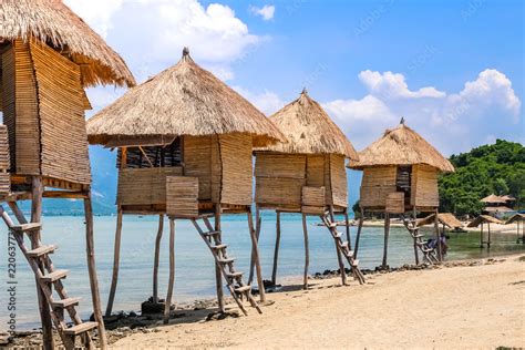 Row Of Tiki Huts Sunny Beach Vacation Ocean Tropical Living Stock Photo