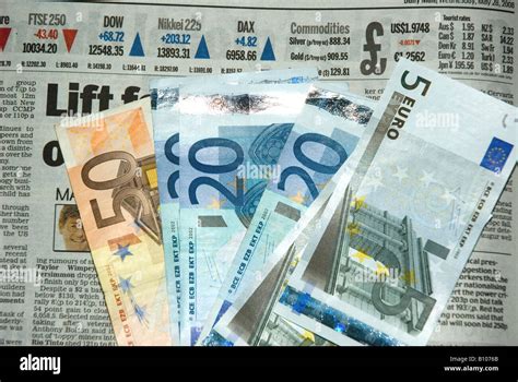 Collection Of Euro Currency Notes On Financial Page Of Daily Newspaper