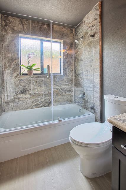 Glass bathtub doors offer a beauty that shower curtains do not have. Frameless Glass Door and Panel over a bathtub