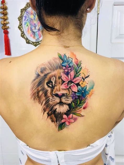 While on a private game reserve, we came across this lion, and drove behind him while he was scent marking along the road. back-tattoo-on-woman-with-black-hair-tribal-lion-tattoo ...