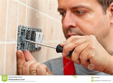 Electrician Mounting Electrical Wall Fixture Stock Photo Image Of
