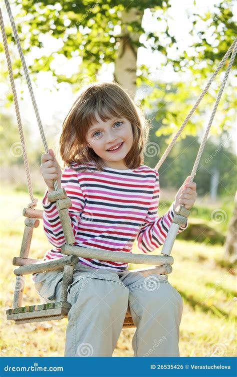 Happy Little Girl On A Swing Stock Photo Image Of Park Happy 26535426