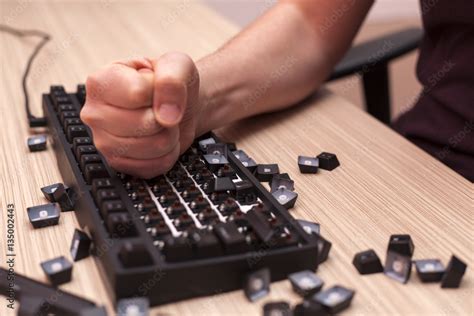 Man Smashes A Mechanical Computer Keyboard In Rage Using One Fist Stock
