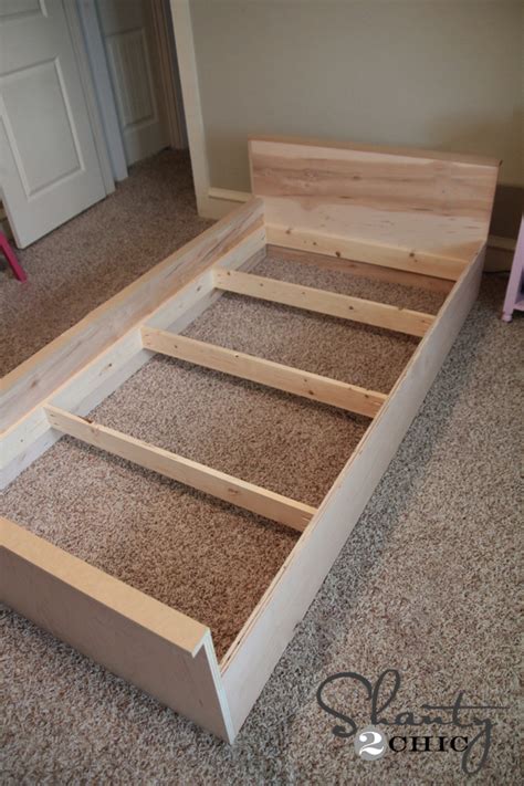 Diy platform bed with storage space as well as baskets. DIY Platform Dresser Bed - Shanty 2 Chic