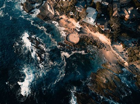 Drone Aerial View Of The Rocky Populated Coast Crashed By The Waves At Laguna Beach Rocky Coast