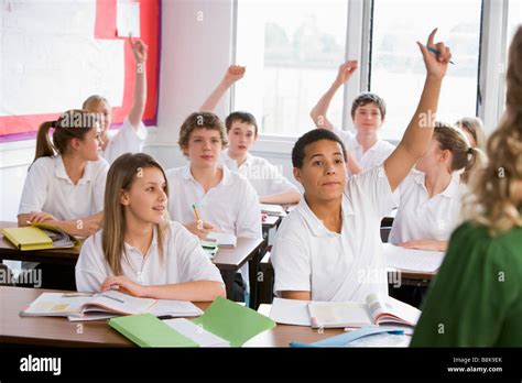 Secondary School Students In A Classroom Answering Questions Stock