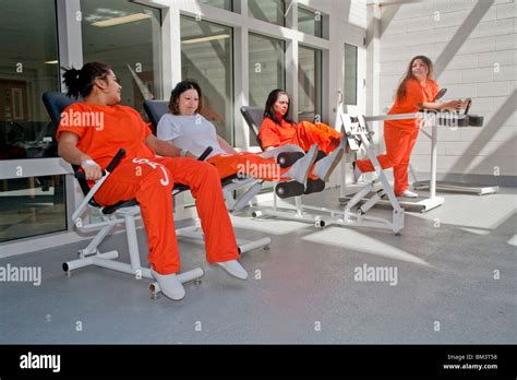 Multi Ethnic City Jail Womens Unit Inmates Use Exercise Yard Equipment
