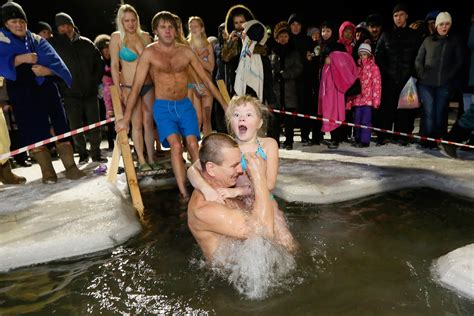 Russian Orthodox Christians Plunge Into Icy Rivers And