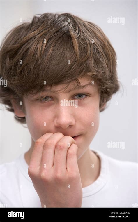Portrait Of A Teenage Boy Biting His Nails Stock Photo Alamy