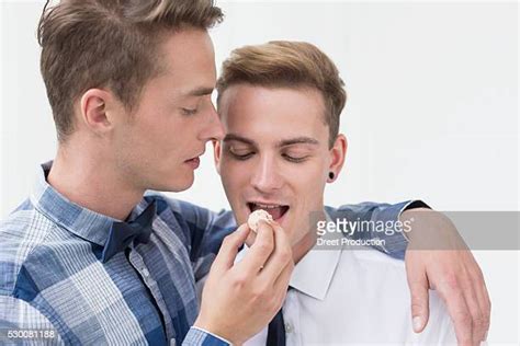 gay men eating photos and premium high res pictures getty images