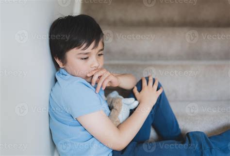 Sad School Kid Sitting Alone On Staircase In The Morning Lonely Boy