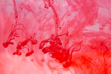 Red Ink In The Water Abstract Background Swirls Of Paint In Liquid