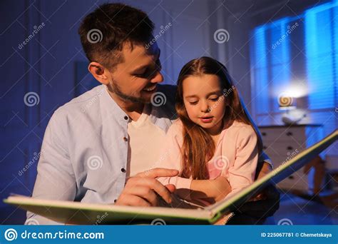 father reading bedtime story to daughter at home stock image image of little daughter 225067781