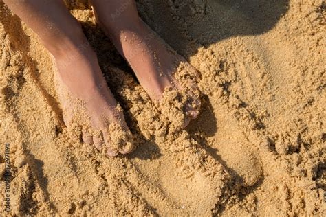 Picture Of Female Feet Buried In Sand At The Beach Foto De Stock