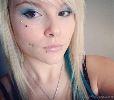 A snake bite piercing is done on the lower lip and is composed of two piercings. Snakebite Piercings - Page 3