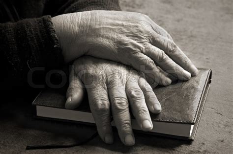 Old Hands On Bible Stock Image Colourbox