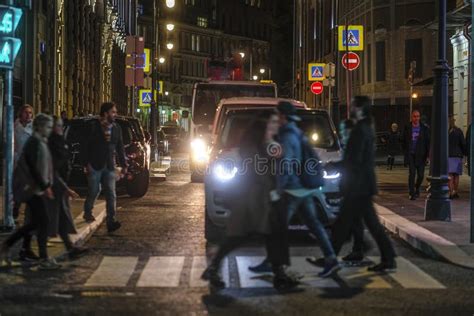 Pedestrians Cross The Road In Moscow At Night Editorial Stock Photo