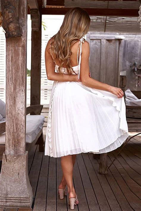 White Spaghetti Strap Dress With V Neck And Backless Design