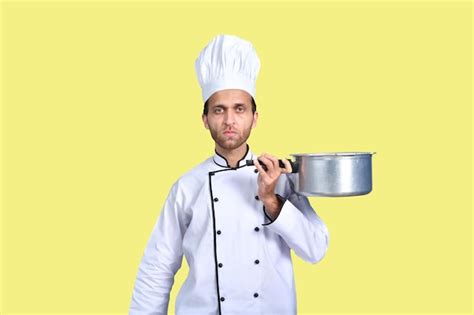 Premium Photo Handsome Chef Cook White Outfit Holding Pan Indian Pakistani Model