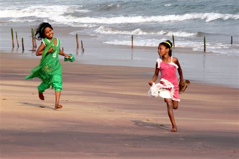 girls running on the beach free image download