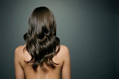 Naked Woman With Long Shiny Wavy Hair Photograph By Andreas Kuehn