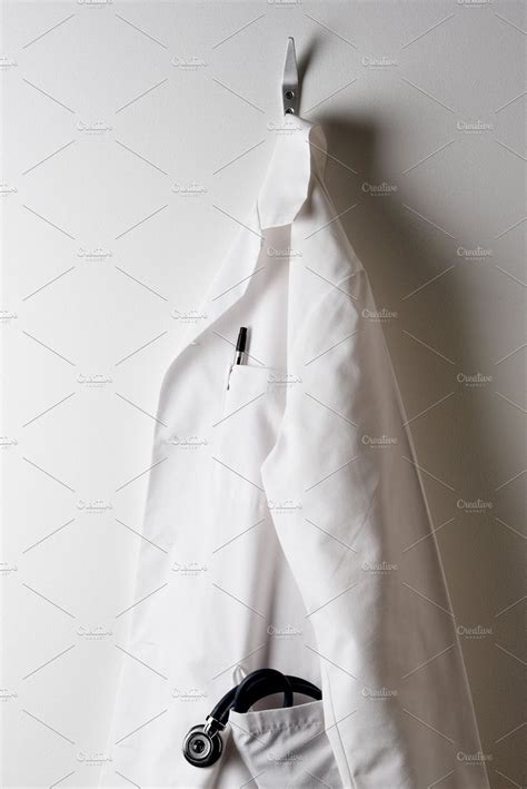 Ad A Doctors White Lab Coat And Hanging By Steve Cukrov