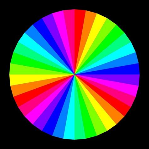 A Rainbow Wheel Is Shown In The Middle Of A Black Background With Only