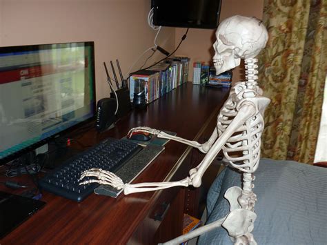 Skeleton Waiting At Desk