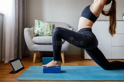 Woman Stretching Legs By Online Yoga Class At Home Stock Photo Image