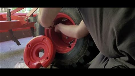 Installing Kubota Bx23s Tractor Wheel Weights Youtube